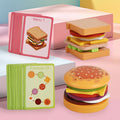 Wooden educational toys for children: miniature, bite-sized hamburgers and sandwiches that simulate real food.